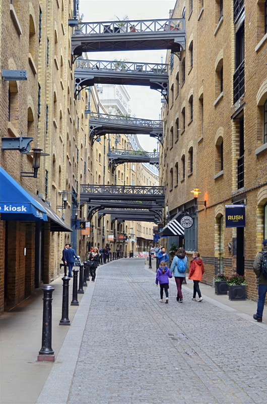 15 - Shad Thames, a historic riverside street in London known for its tall brick warehouses and overhead metal walkways